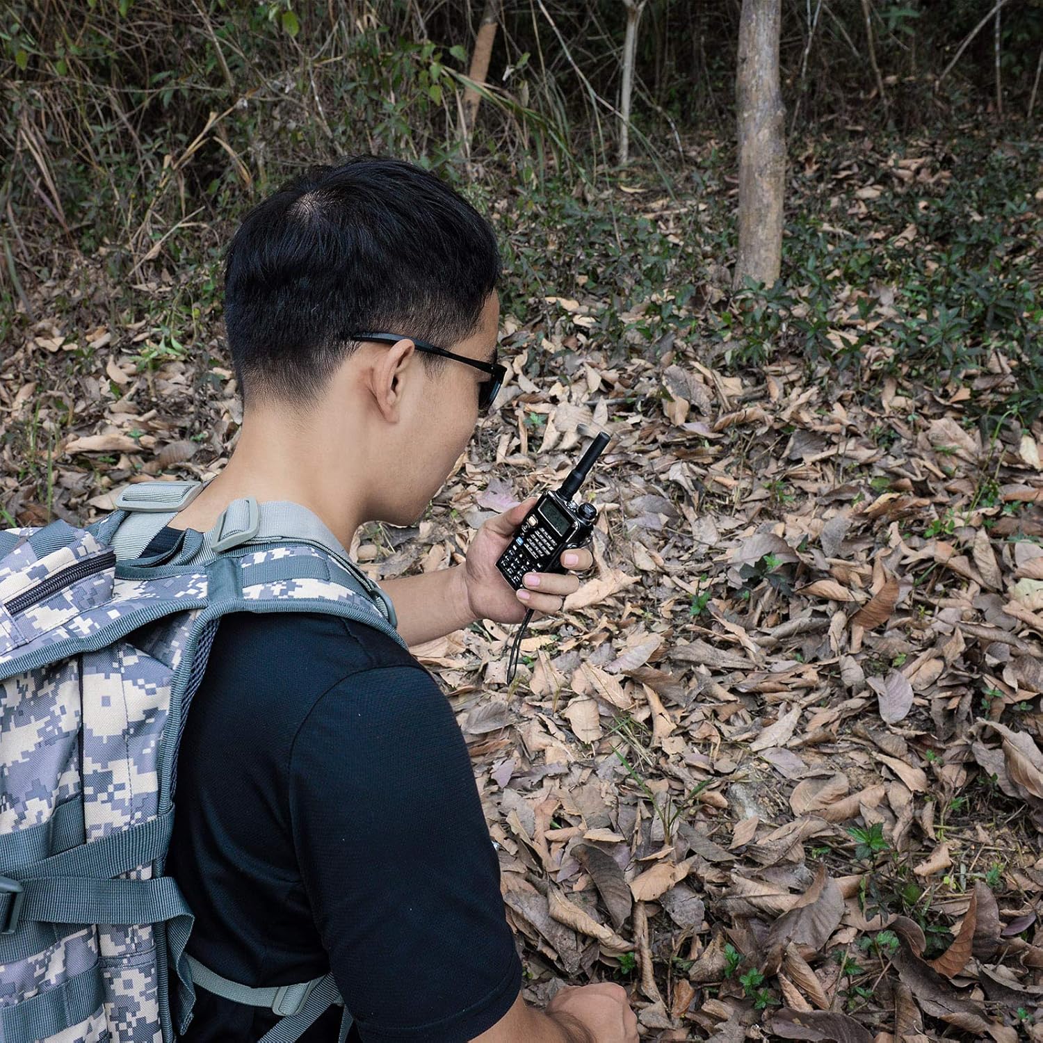 Amateur radio operator using the compact antenna for portable, lightweight communications