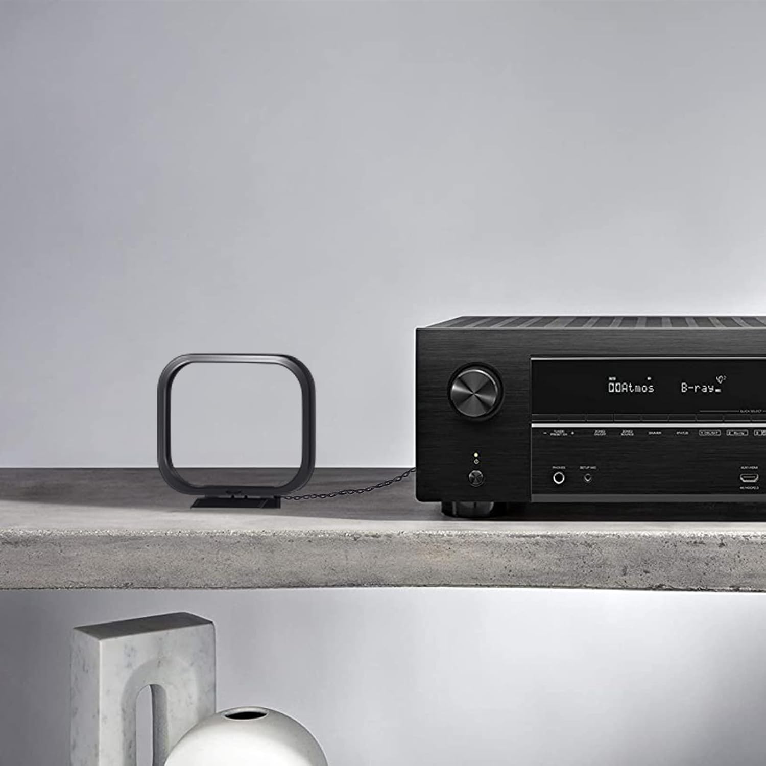 Installation guide showing how to plug the 3-pin AM antenna into the back of a compatible Sony STR-ZA or Sharp CD series receiver