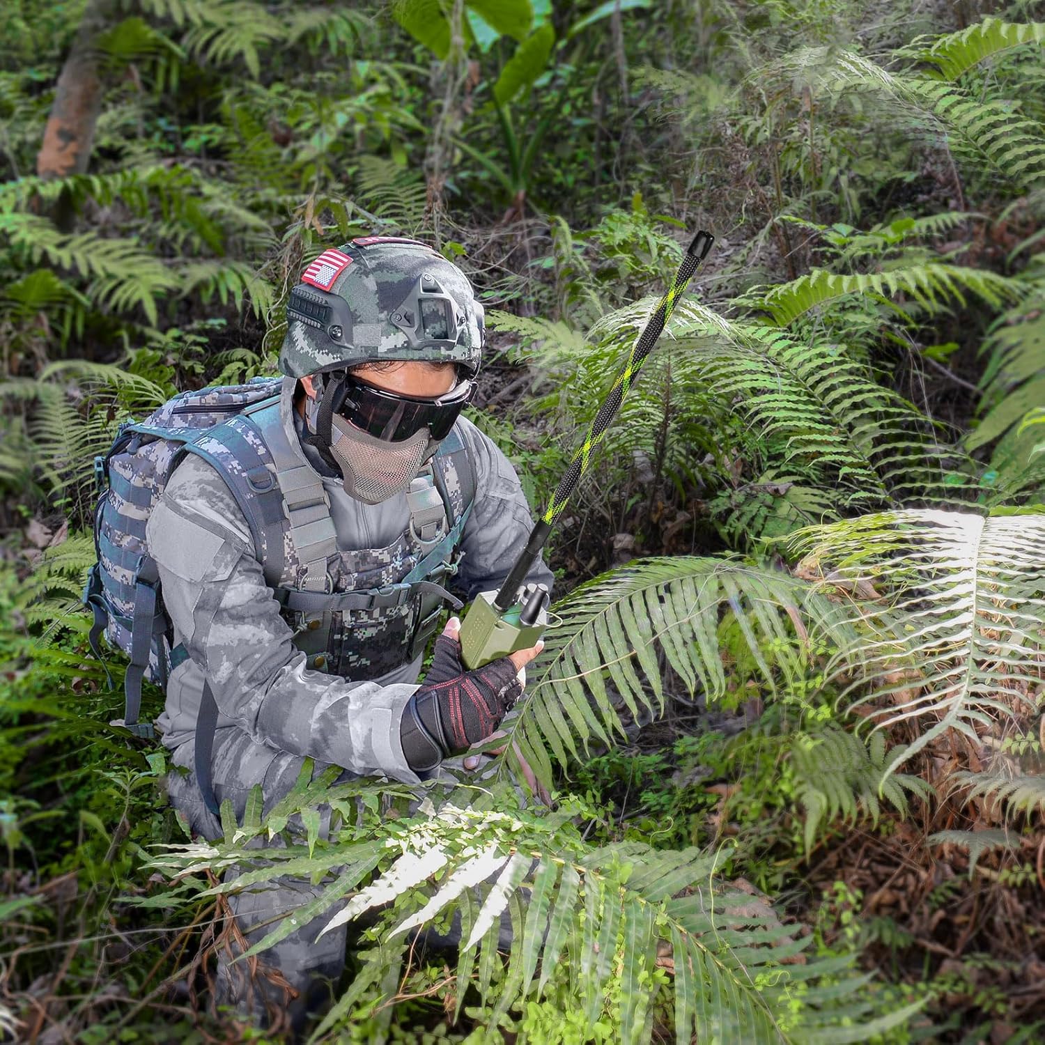 A user carrying a radio with the Bingfu tactical antenna folded and secured with the included Velcro strap during a hiking trip