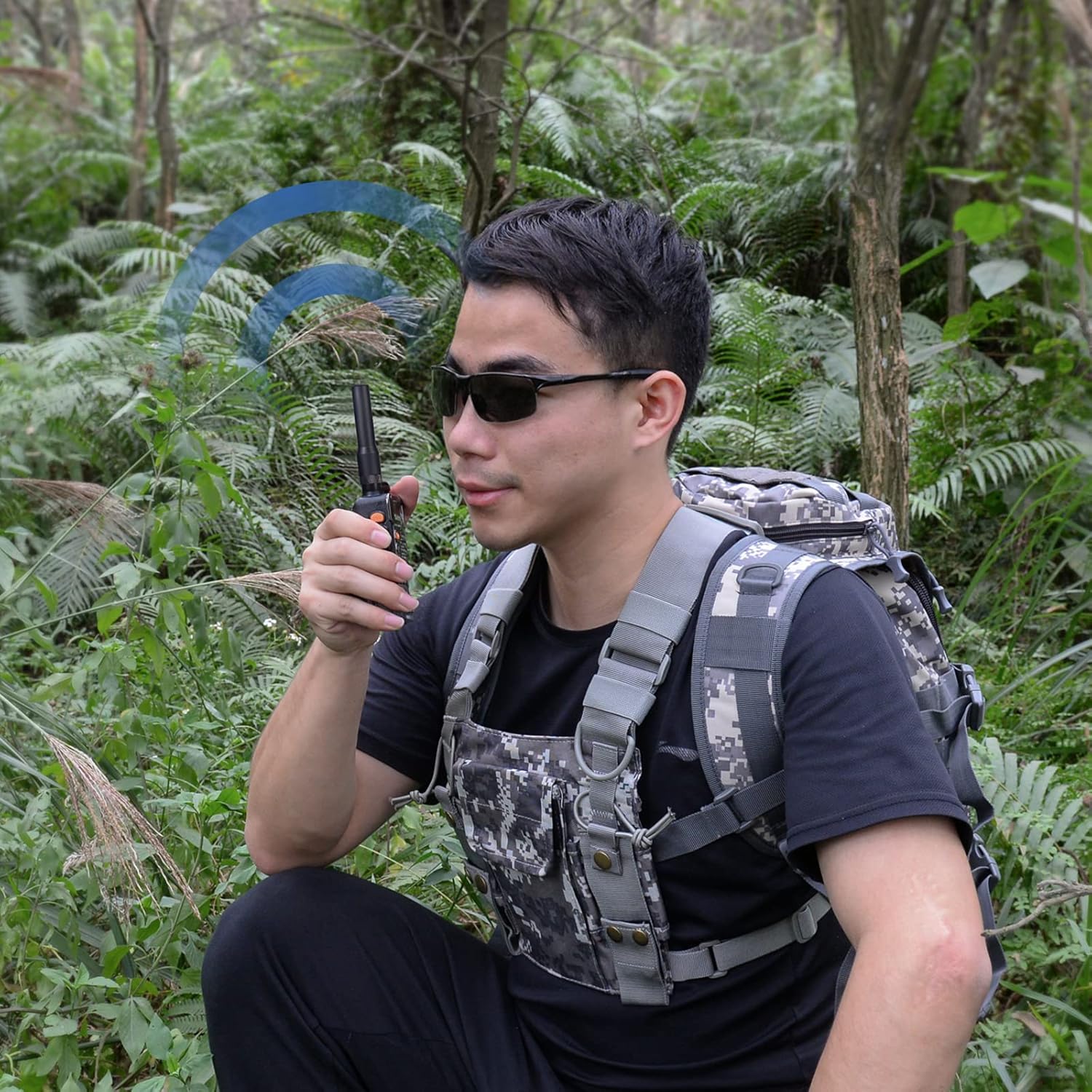 Amateur radio enthusiast using the flexible antenna during hiking or outdoor activities where durability is key