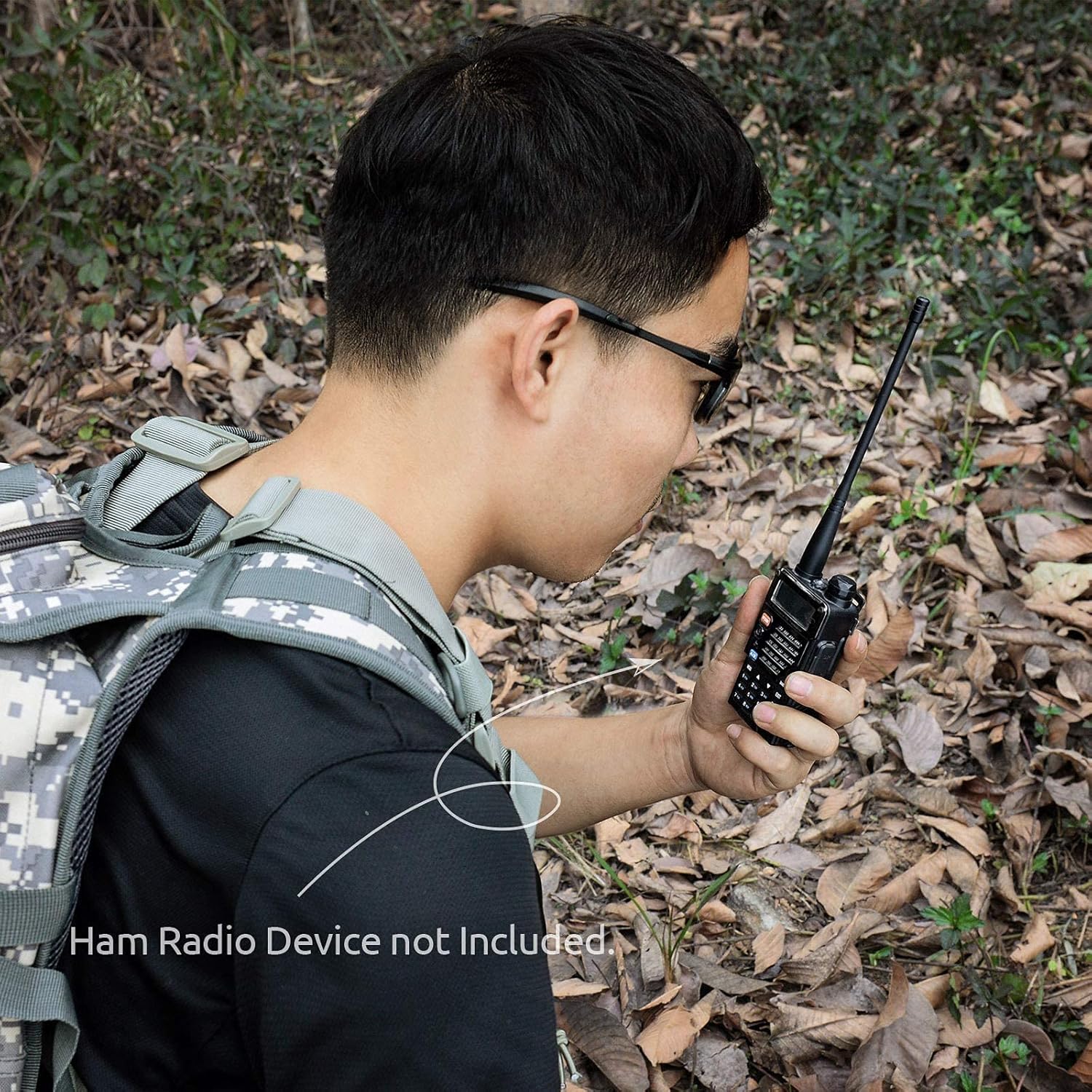 Amateur radio enthusiast using the flexible antenna for portable, outdoor two-way radio communication