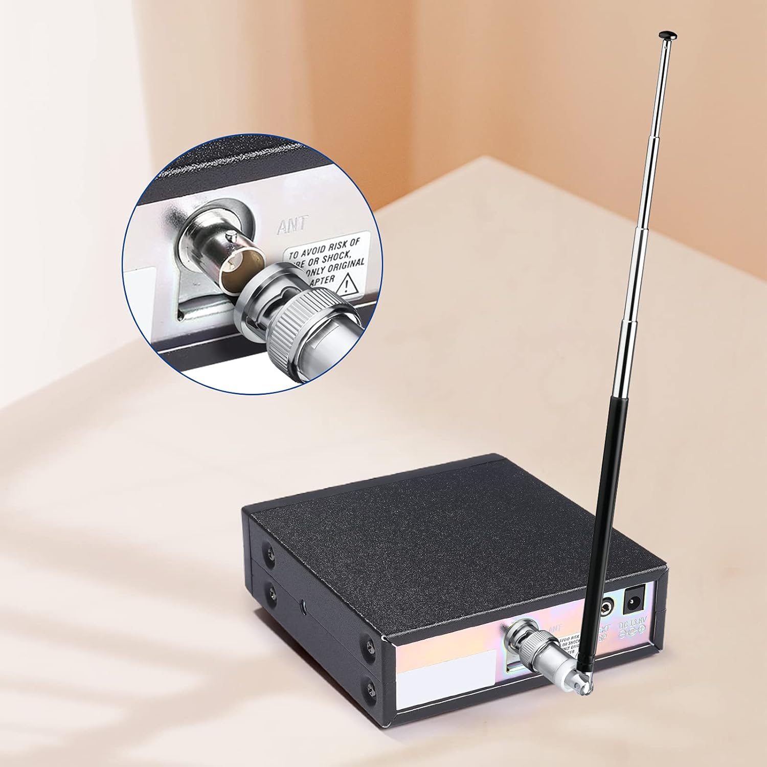 Compact telescopic antenna mounted on a portable radio receiver for travel use