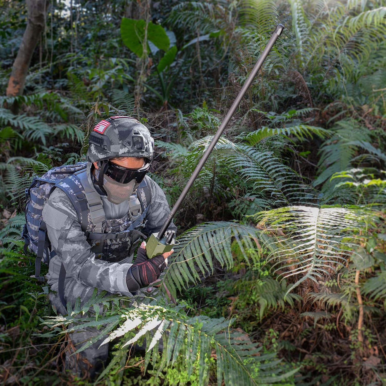 Outdoor use case, showing the antenna's long-range reception capability in a tactical or hiking setting
