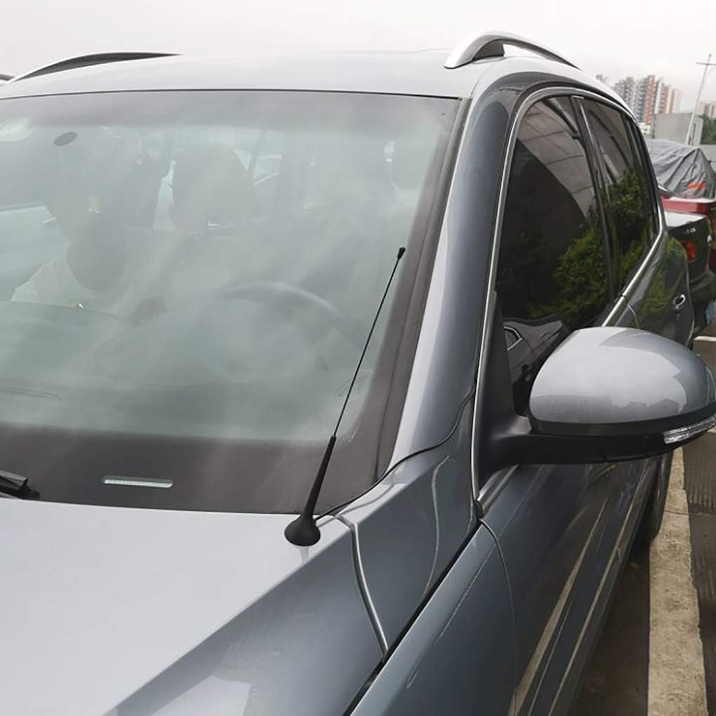 Strong magnetic base being attached to a car roof with the cable routed through the door seal