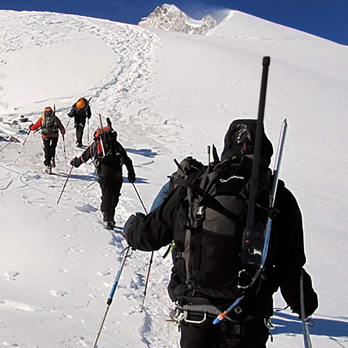 Showing the relocation cable connecting a Baofeng UV-5R to the tactical antenna mounted on a tactical vest or backpack